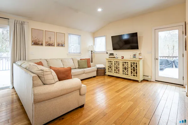a bathroom with a sink a toilet and shower curtain