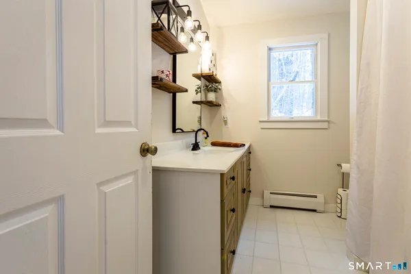 a view of kitchen with furniture and wooden floor