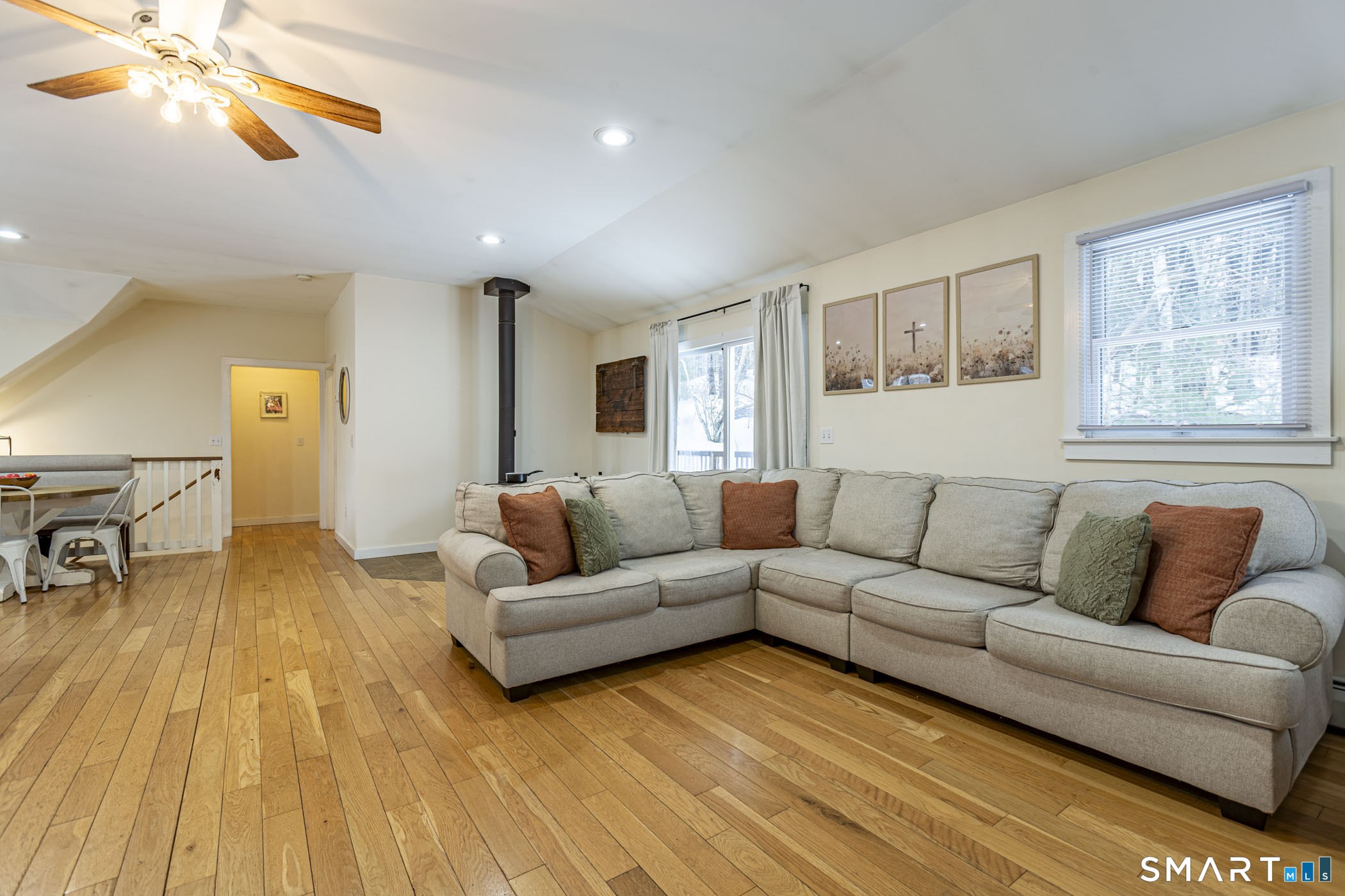 429 Lakeside Road Morris, CT 06763 - Photo 10 of 38 a living room with furniture and a wooden floor