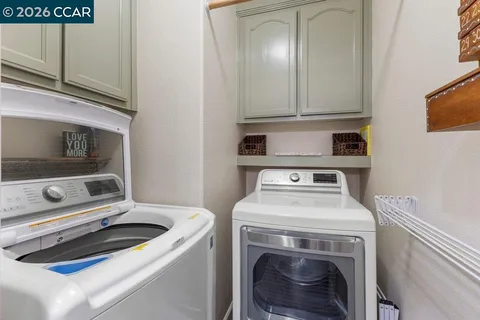 a stove top oven sitting inside of a kitchen