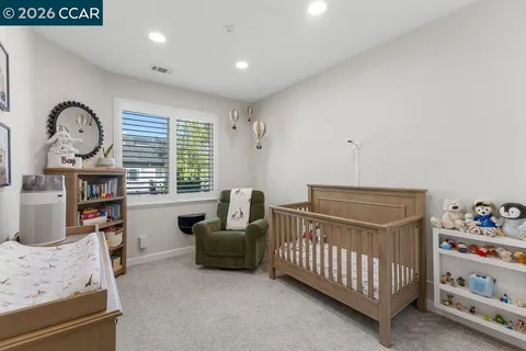 a bedroom with furniture and a window