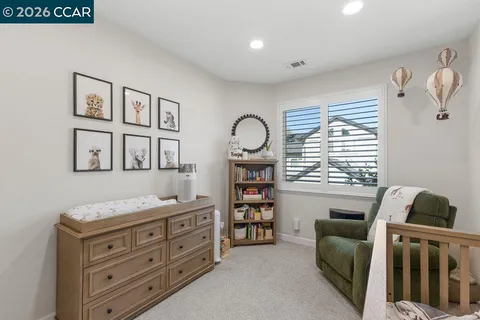 a bedroom with furniture and a window