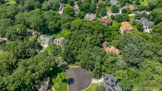 an aerial view of a house with a yard and outdoor space