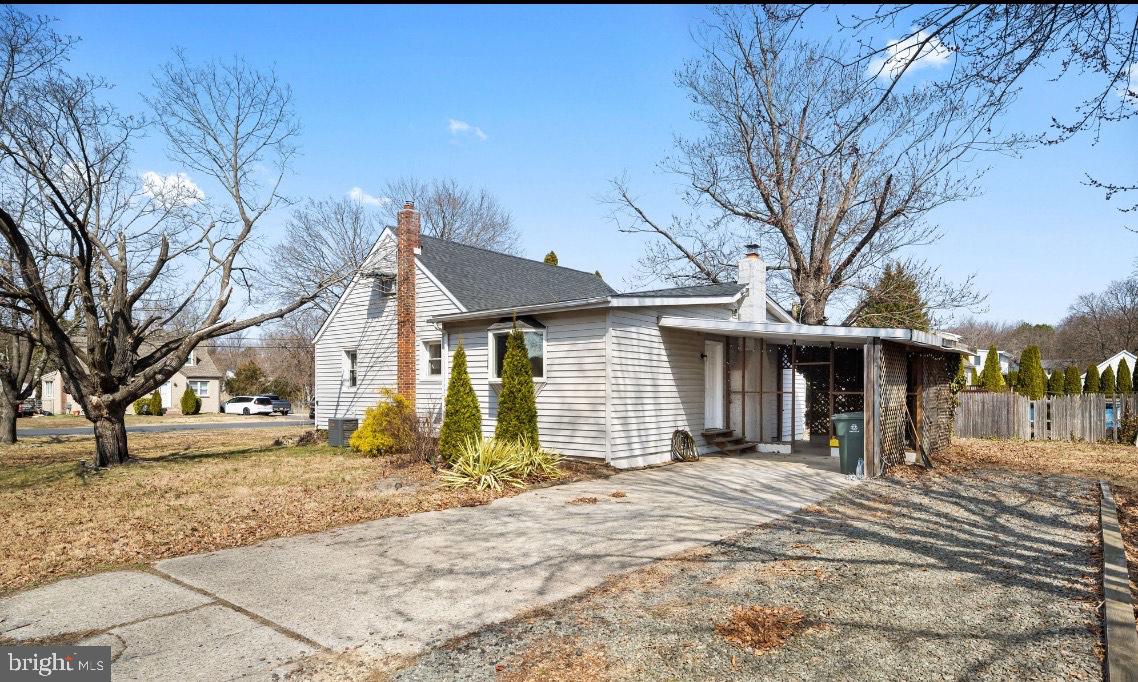 404 Pine Street Williamstown, NJ 08094 - Photo 3 of 24 a front view of a house with a yard covered in snow