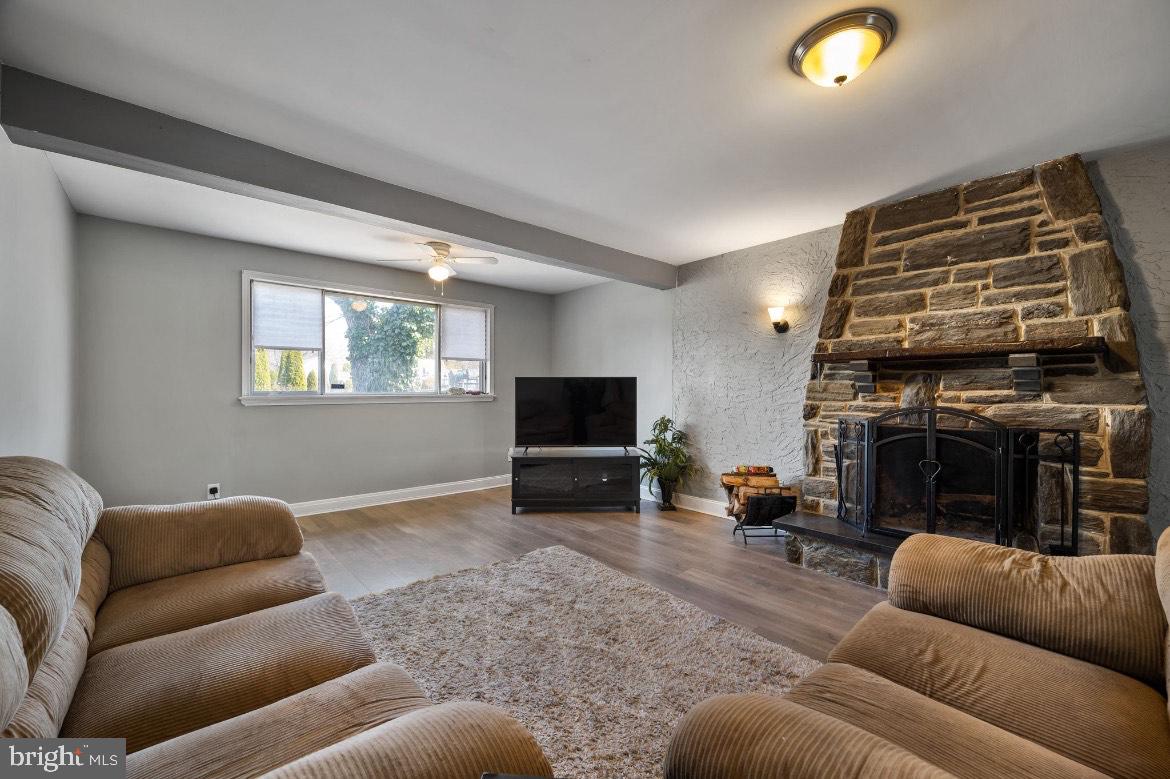 404 Pine Street Williamstown, NJ 08094 - Photo 10 of 24 a living room with furniture a flat screen tv and a fireplace