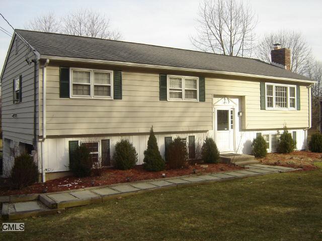 125 Rockwell Road Bethel, CT 06801 - Photo 1 of 1 a front view of a house with a yard