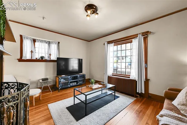a living room with furniture and a flat screen tv