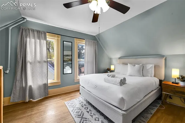 a bedroom with a large bed and a window