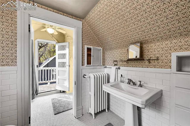 a bathroom with a sink a mirror and a bathtub