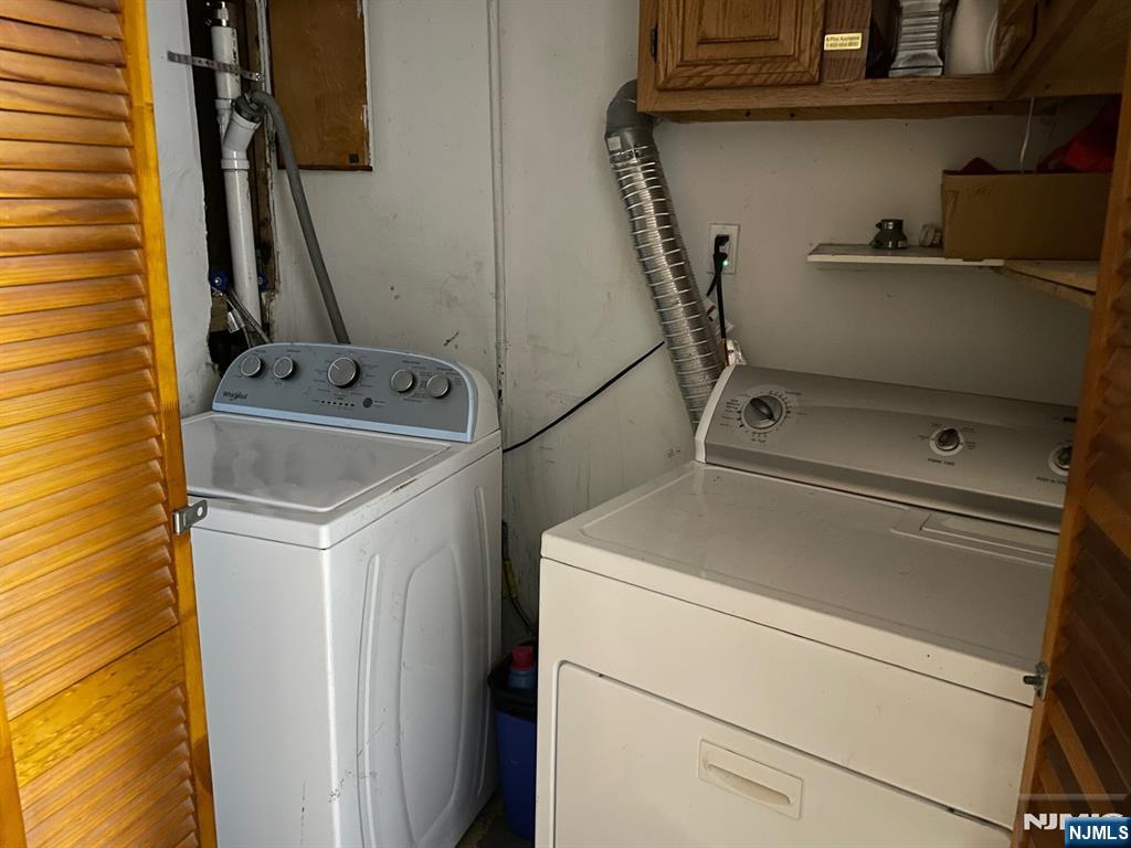 3 Ann Street, Unit 1F Harrison, NJ 07029 - Photo 15 of 15 a utility room with dryer and washer