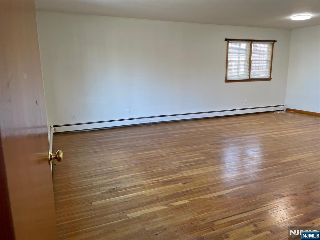 3 Ann Street, Unit 1F Harrison, NJ 07029 - Photo 2 of 15 wooden floor in an empty room