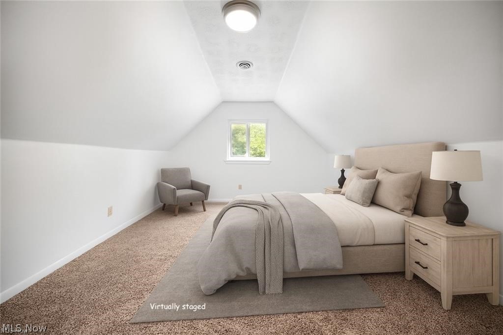 28300 Aurora Road Solon, OH 44139 - Photo 26 of 36 Room featuring sloped ceilings, a single window, and neutral carpet flooring