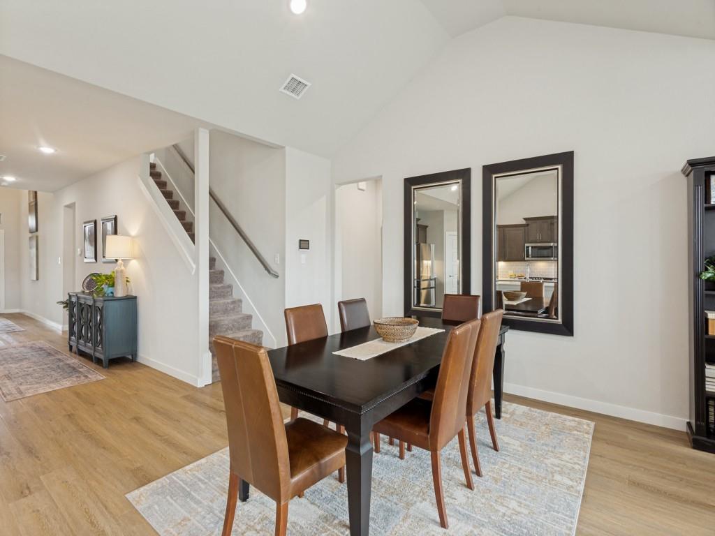 10613 Smiths Bnd Road Fort Worth, TX 76126 - Photo 11 of 29 Bright dining area featuring wood-finish flooring and a vaulted ceiling