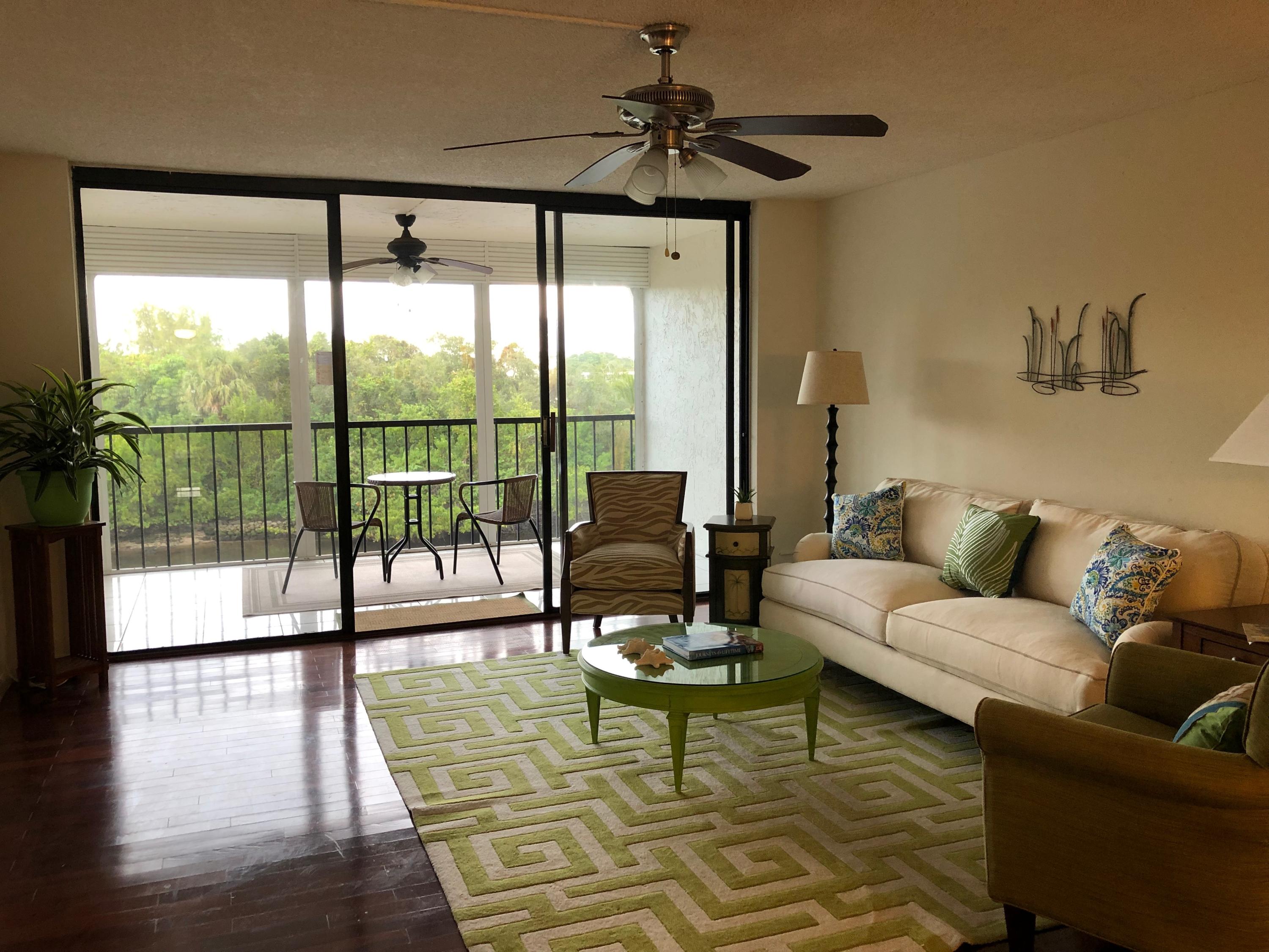 1631 Riverview Road, Unit 306 Deerfield Beach, FL 33441 - Photo 10 of 56 LIVING ROOM W/ WALL TO WALL SLIDERS