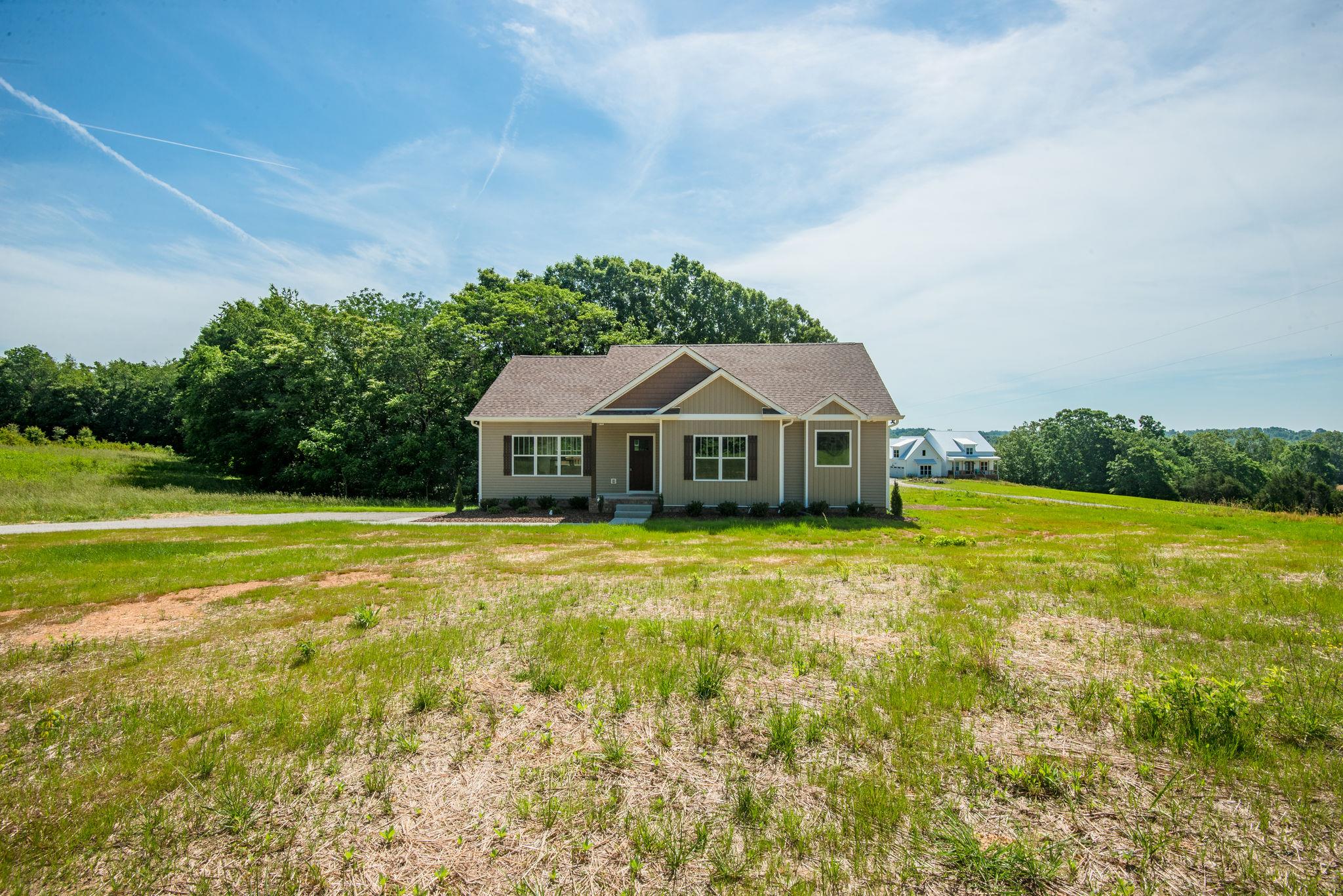 1507 East Piney Road Dickson, TN 37055 - Photo 1 of 30 a front view of a house with a yard