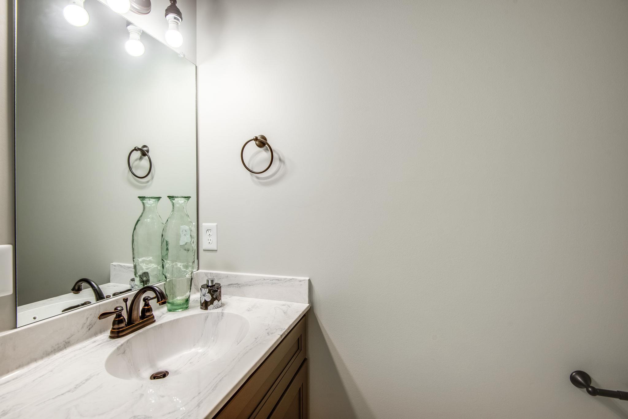 1507 East Piney Road Dickson, TN 37055 - Photo 20 of 30 a bathroom with a sink and a mirror