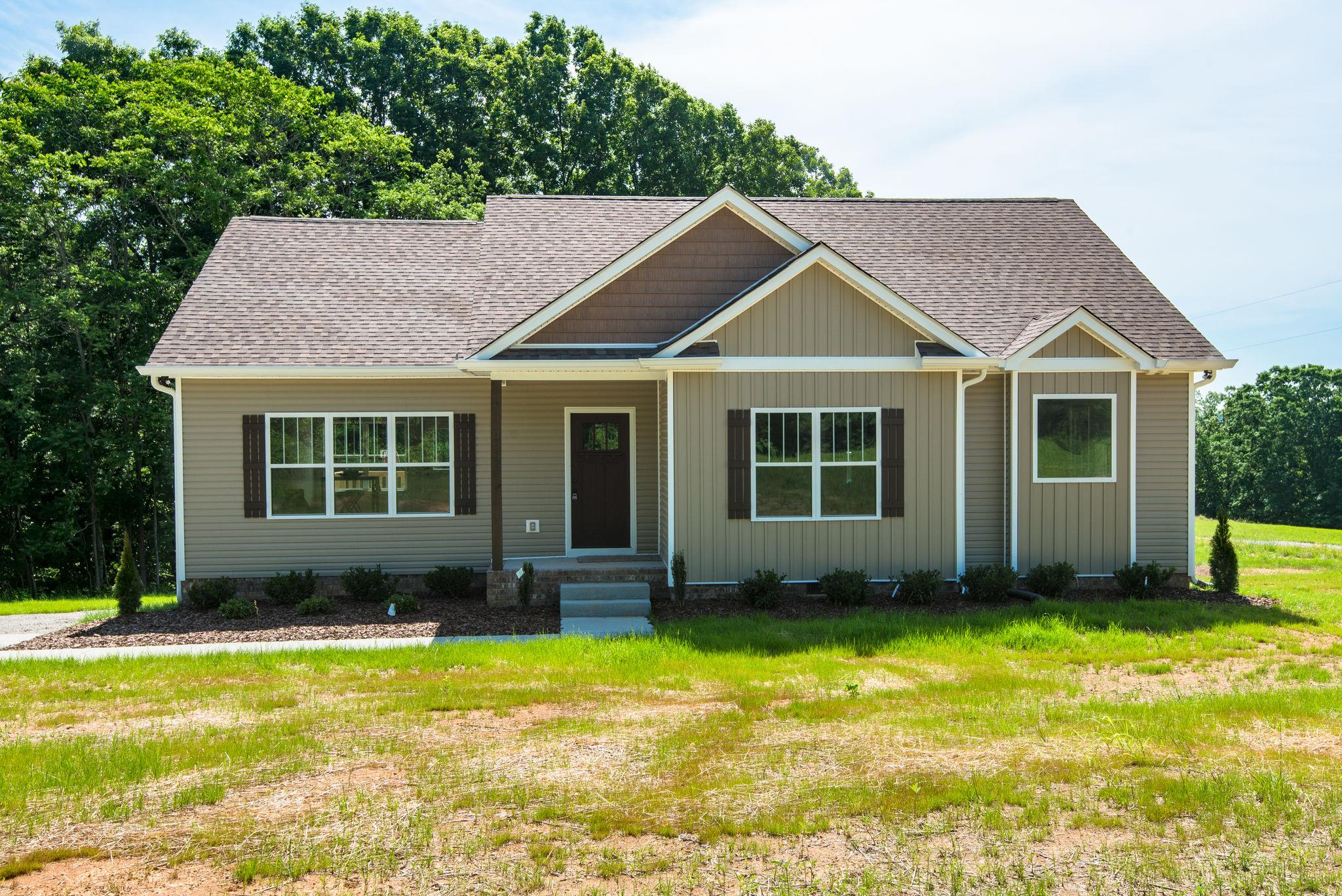 1507 East Piney Road Dickson, TN 37055 - Photo 30 of 30 a front view of a house with a yard