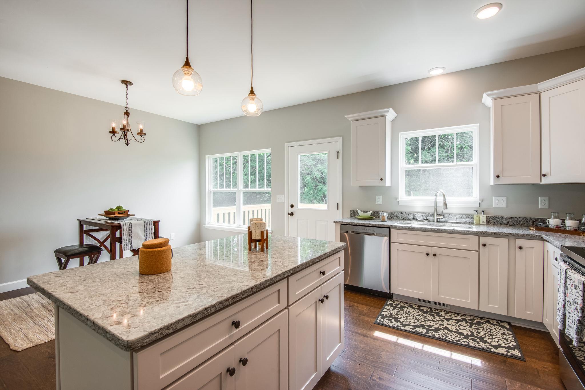 1507 East Piney Road Dickson, TN 37055 - Photo 8 of 30 a kitchen with center island and stainless steel appliances