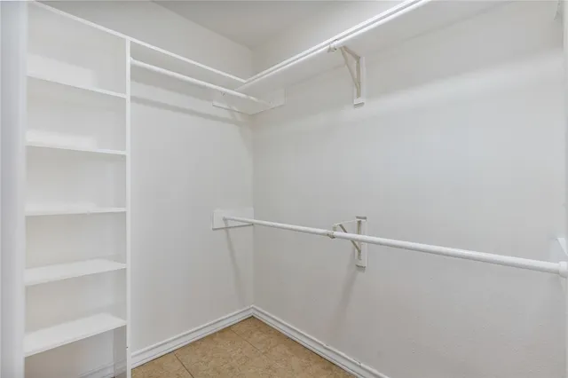 a view of an empty walk in closet