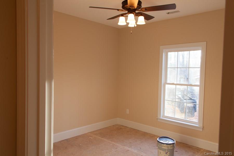 707 Cooks Cove Ridge Clover, SC 29710 - Photo 13 of 18 an empty room with windows and fan