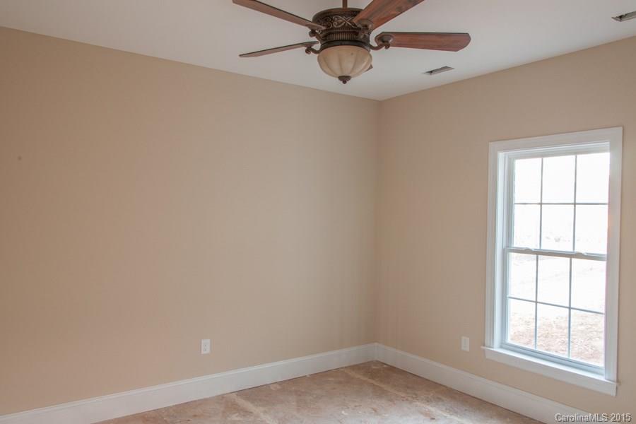 707 Cooks Cove Ridge Clover, SC 29710 - Photo 15 of 18 an empty room with a window and a fan