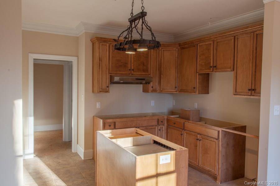 707 Cooks Cove Ridge Clover, SC 29710 - Photo 5 of 18 a kitchen with stainless steel appliances granite countertop a sink refrigerator and microwave
