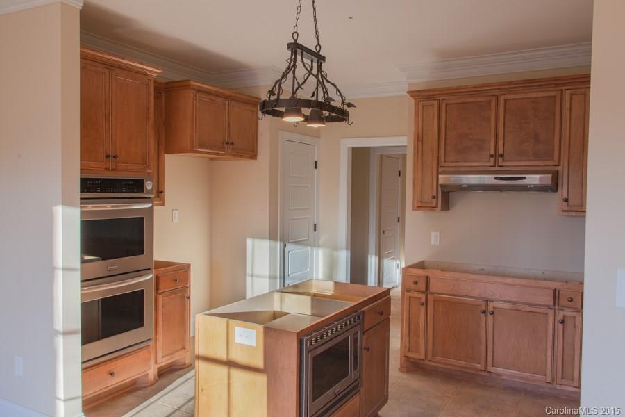 707 Cooks Cove Ridge Clover, SC 29710 - Photo 6 of 18 a kitchen with a stove microwave and refrigerator