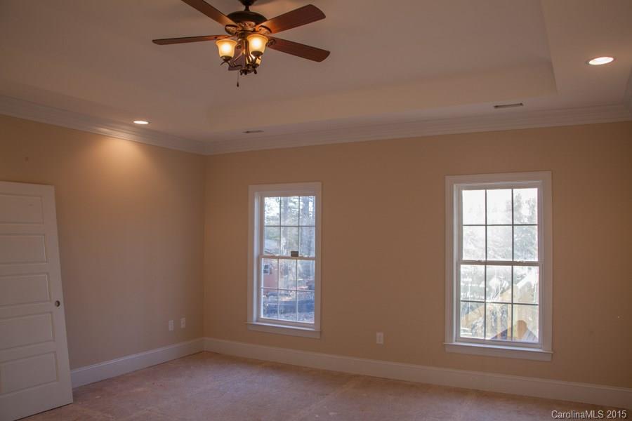 707 Cooks Cove Ridge Clover, SC 29710 - Photo 10 of 18 an empty room with windows and fan