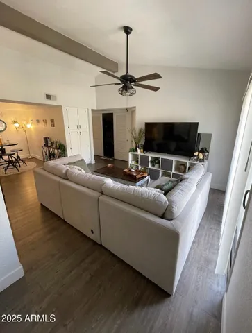 a living room with furniture and a flat screen tv