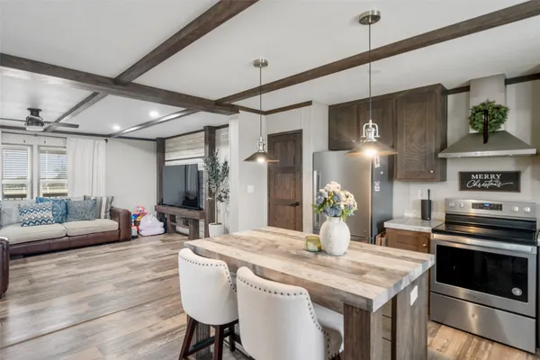 a kitchen with a sink stove top oven and cabinets