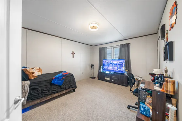 a spacious bathroom with a double vanity sink a large mirror and a bathtub