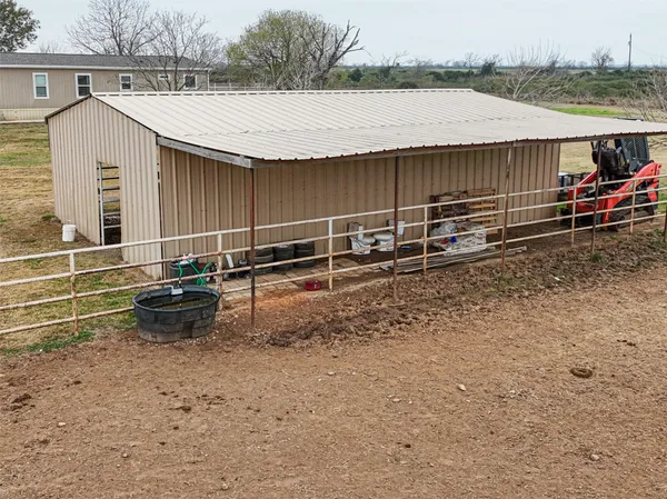 a view of a lake with houses in the back
