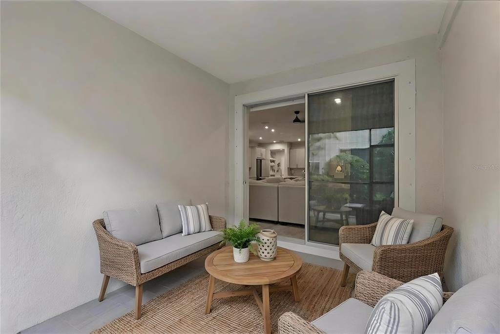 19431 Monarch Wind Way Lutz, FL 33558 - Photo 13 of 17 a living room with furniture and a potted plant