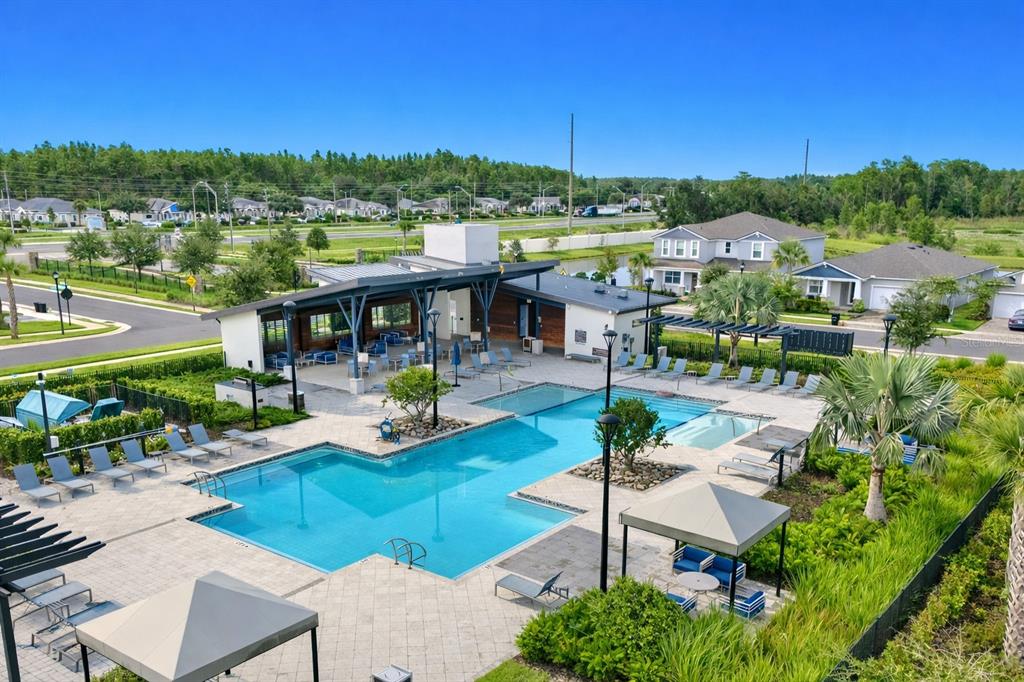19431 Monarch Wind Way Lutz, FL 33558 - Photo 15 of 17 a view of a patio with a table and chairs