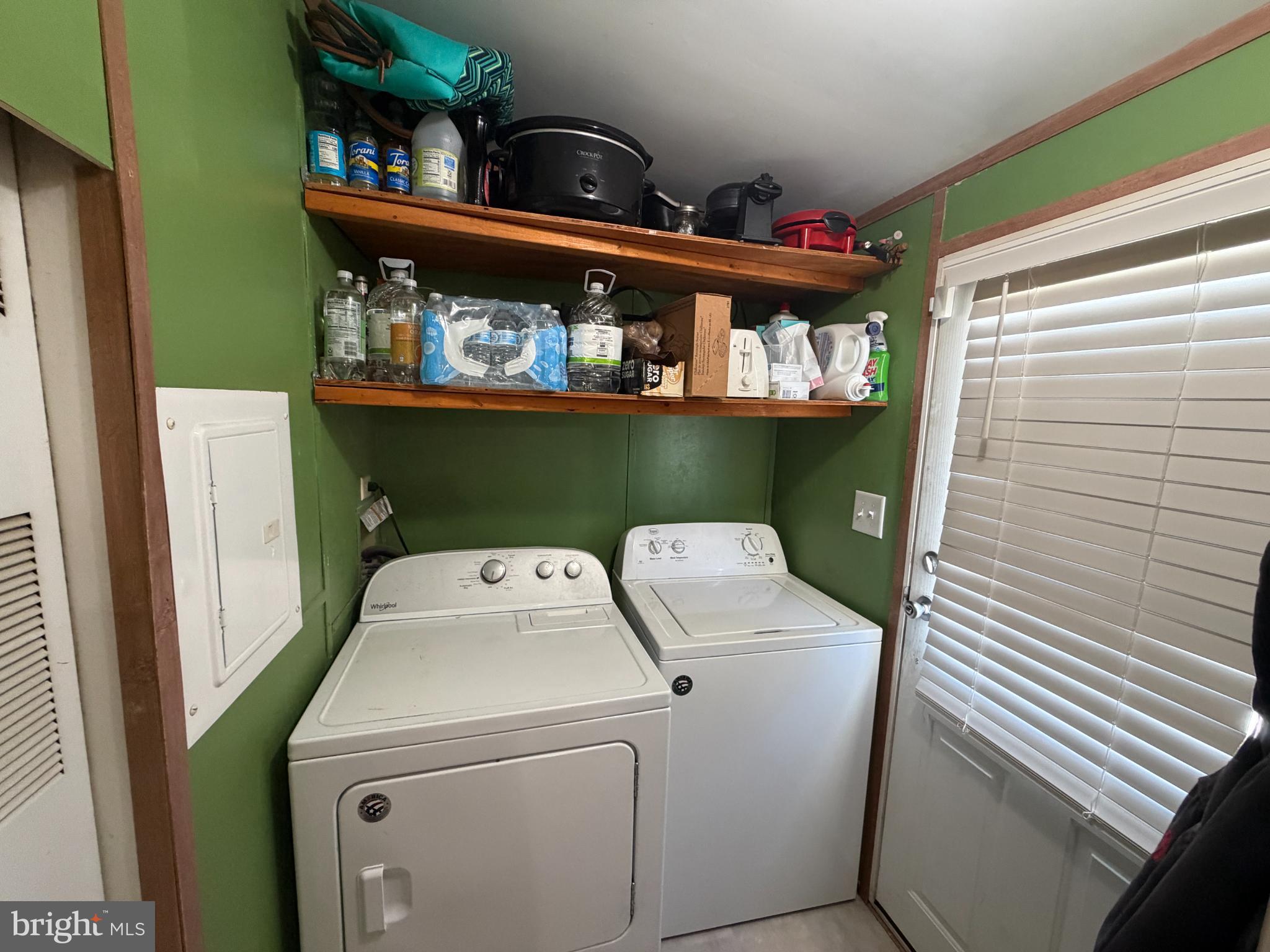 444 Long Branch Road Seaford, DE 19973 - Photo 16 of 22 Efficient laundry space with vibrant green walls.