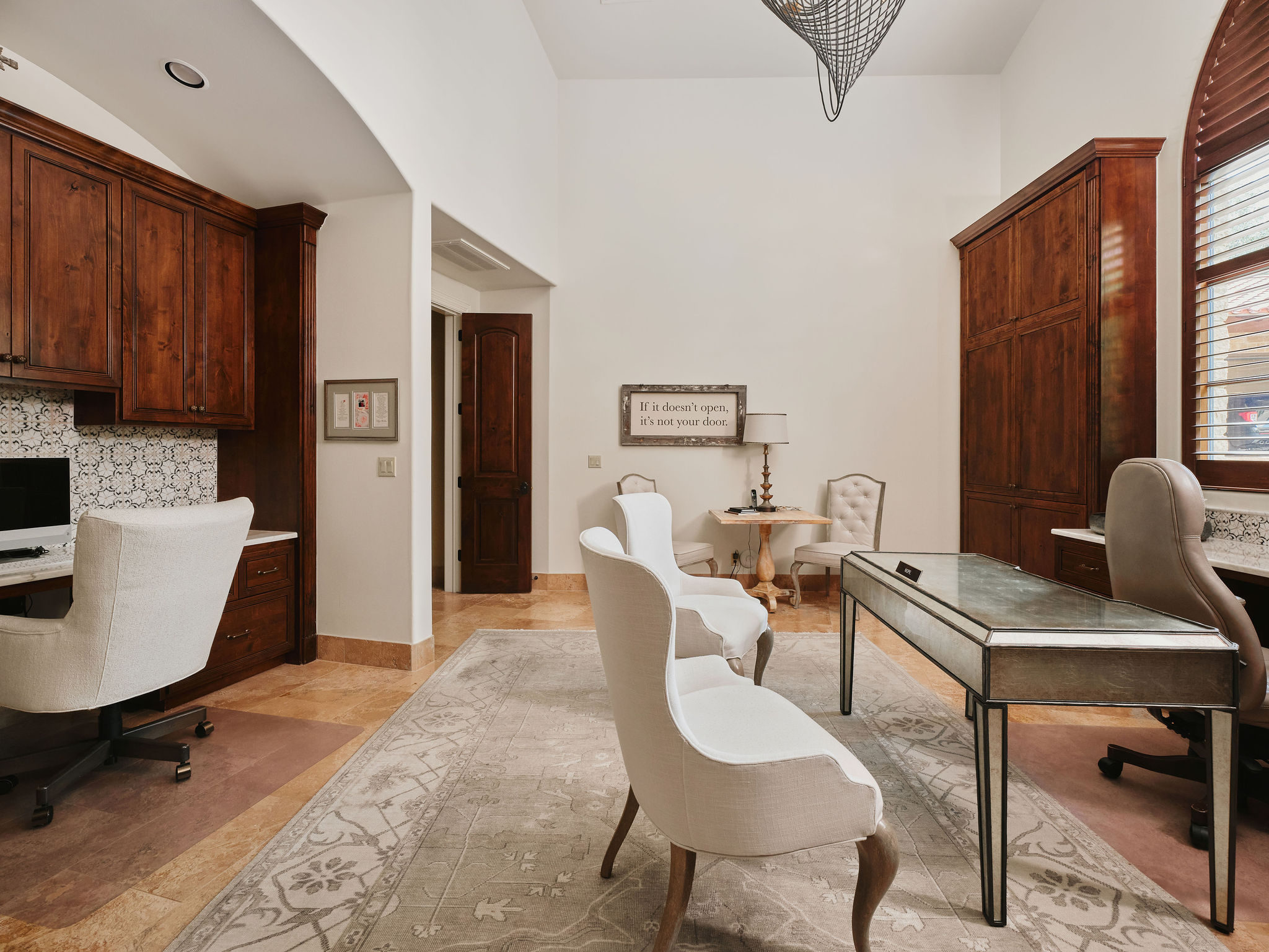 433 Brandon Way Austin, TX 78733 - Photo 22 of 40 Custom cabinetry and ample desk space define this well-appointed home office.