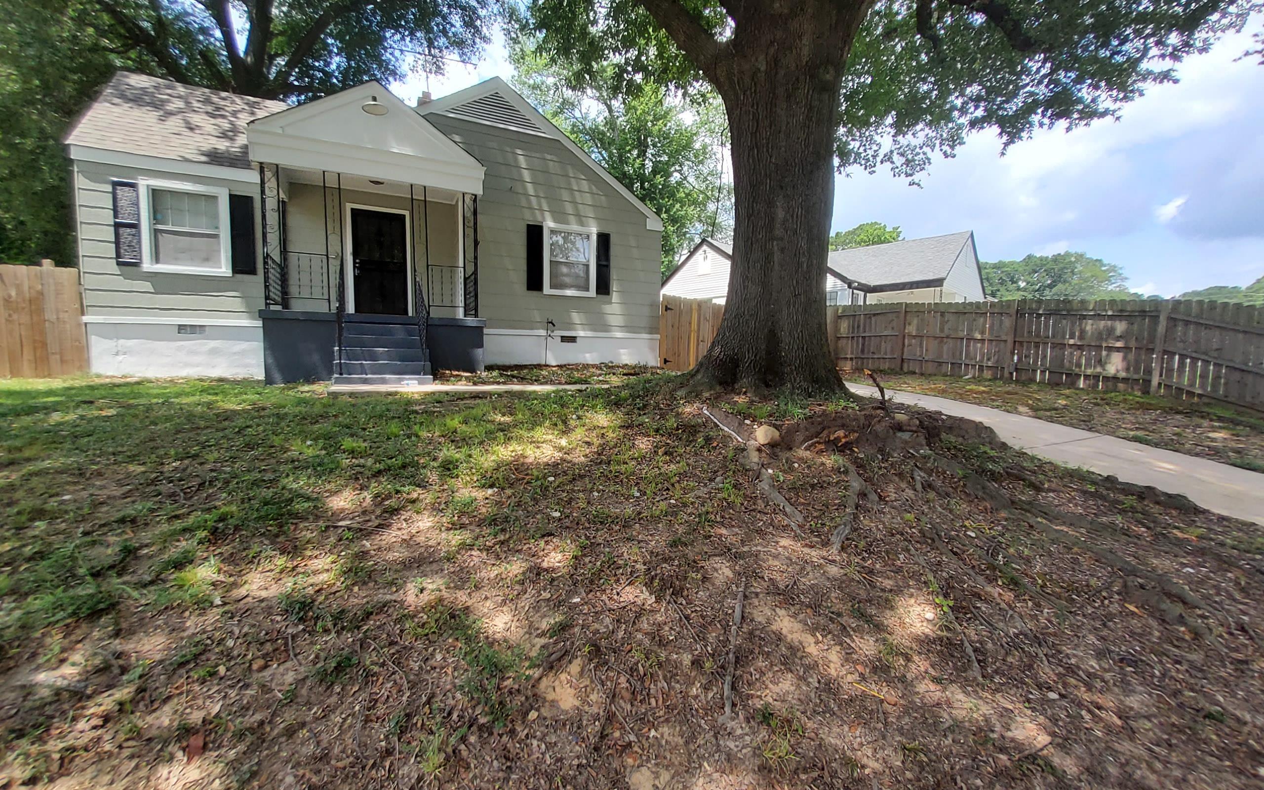 1401 Alamo Street Memphis, TN 38114 - Photo 1 of 11 a front view of house with yard