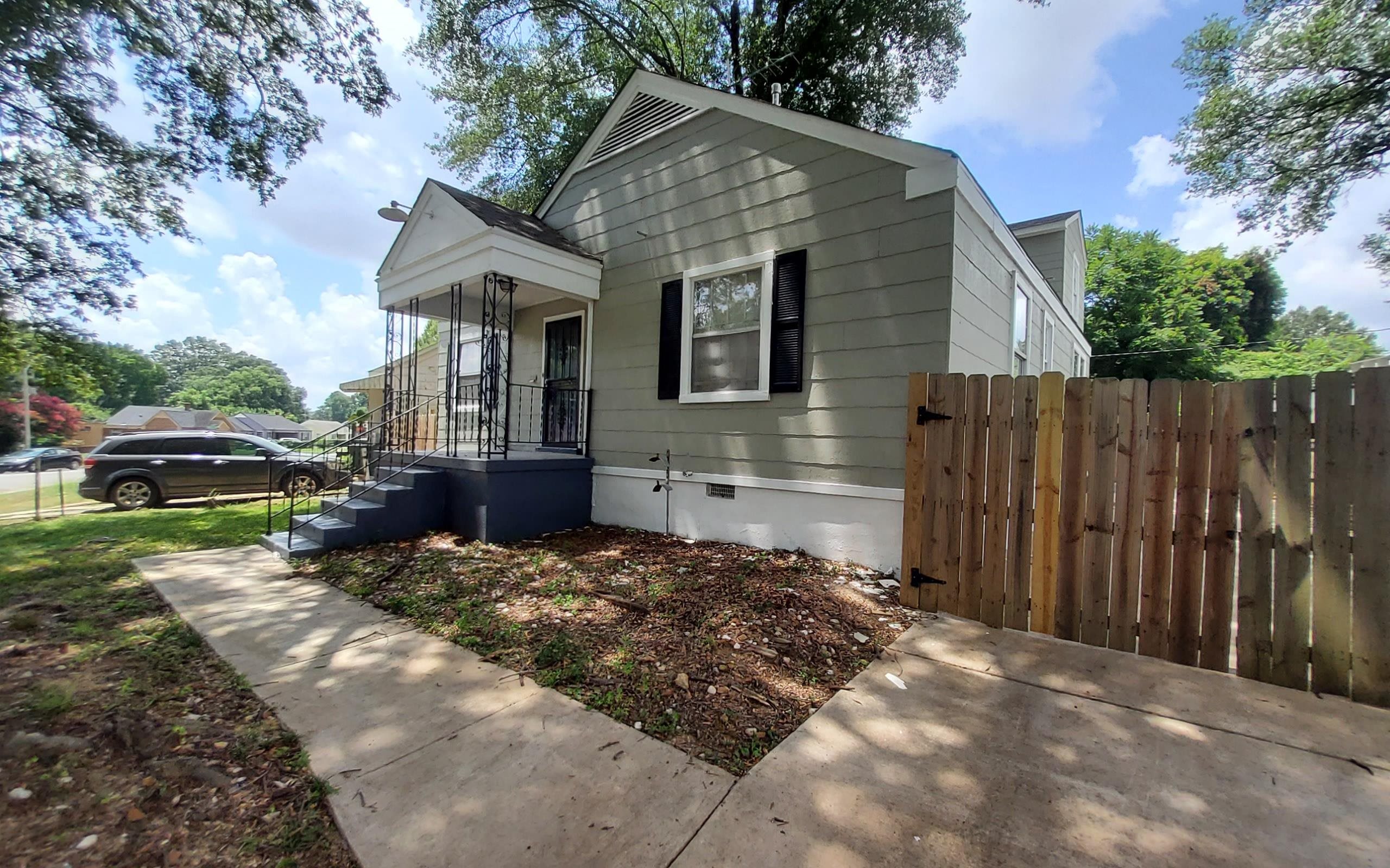 1401 Alamo Street Memphis, TN 38114 - Photo 2 of 11 a front view of a house with a yard