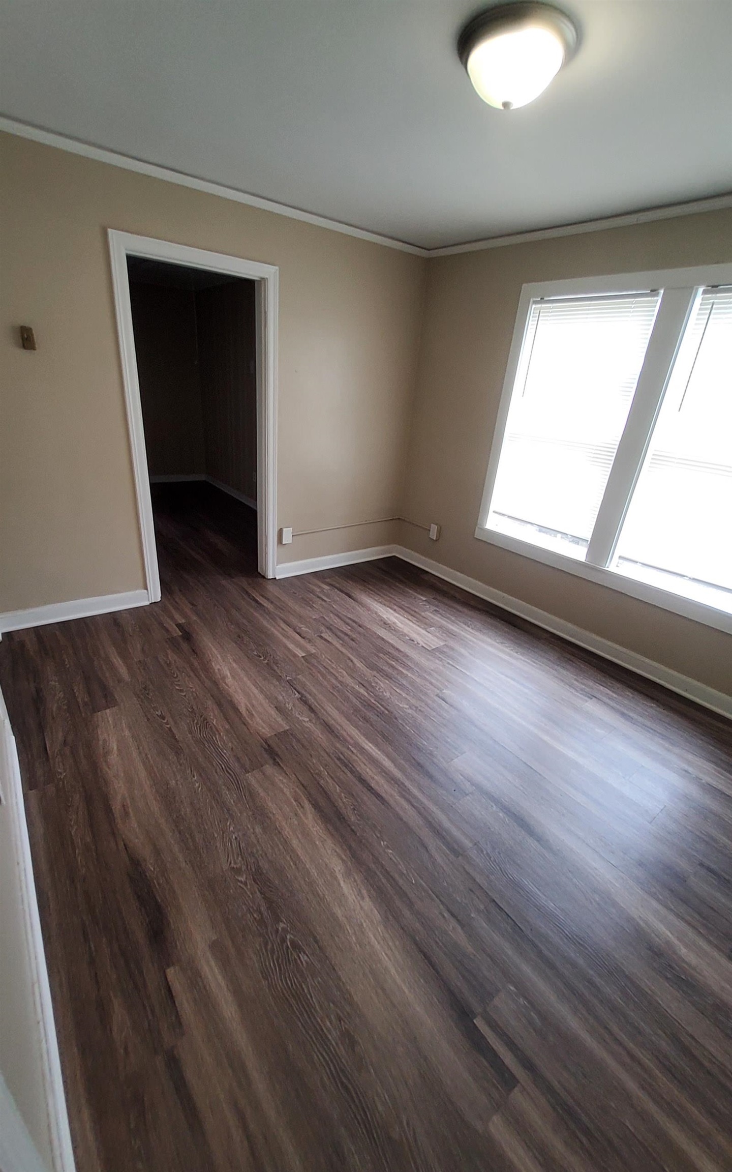 1401 Alamo Street Memphis, TN 38114 - Photo 10 of 11 an empty room with wooden floor and windows