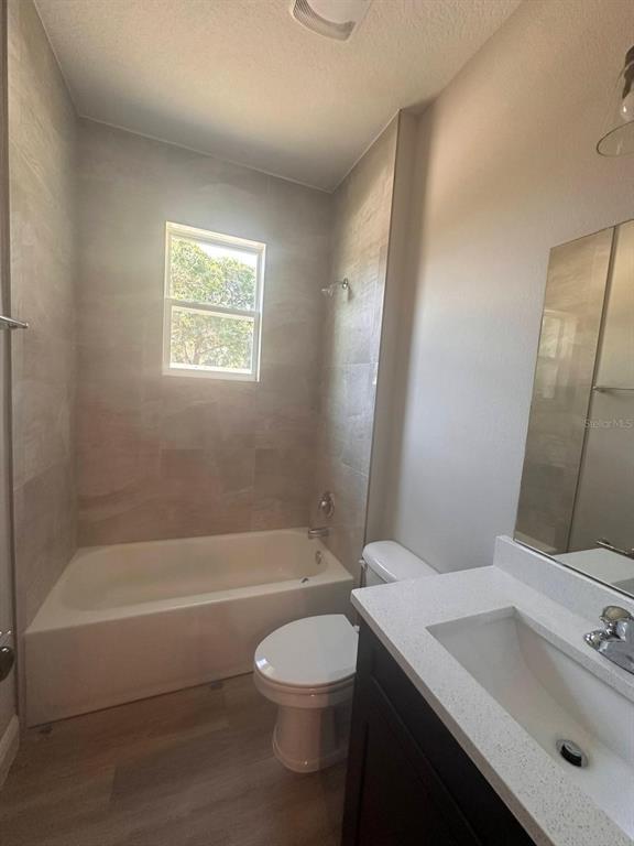 1575 South Montgomery Street DeLand, FL 32720 - Photo 9 of 12 a bathroom with a sink a toilet and shower