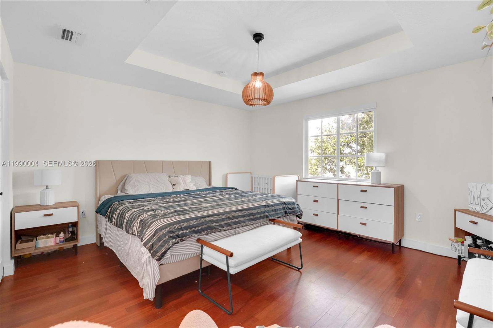 738 Northeast 90th Street, Unit 207 Miami, FL 33138 - Photo 13 of 31 a bedroom with a bed and window