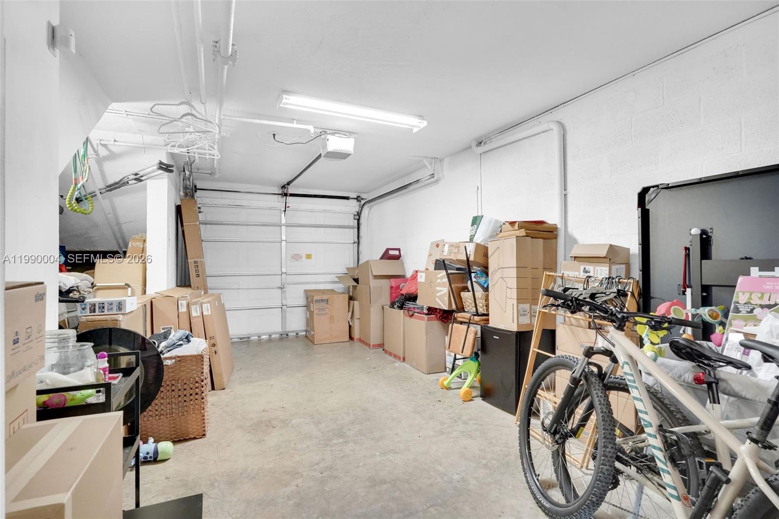 738 Northeast 90th Street, Unit 207 Miami, FL 33138 - Photo 24 of 31 a view of a room with gym equipment