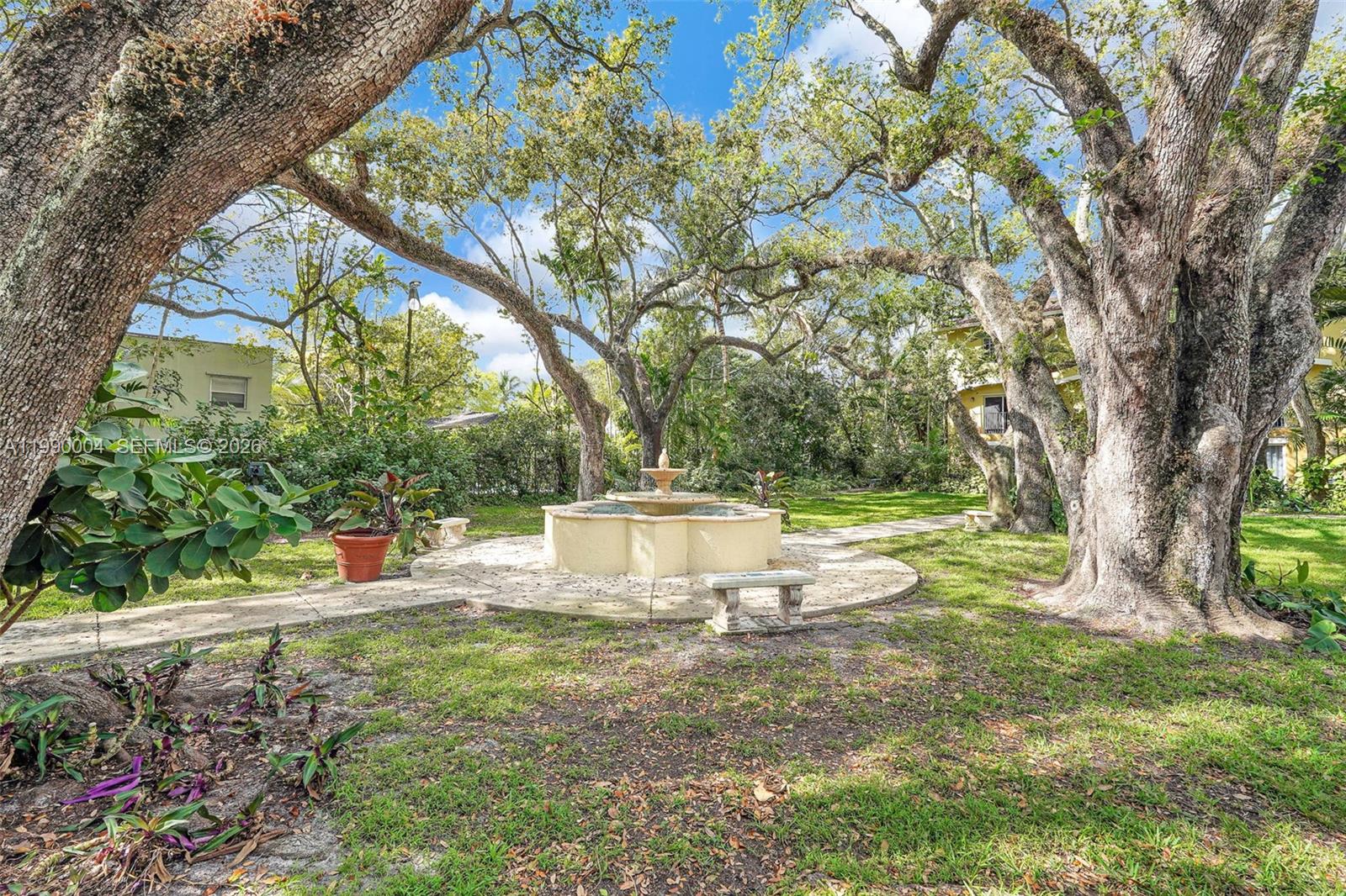 738 Northeast 90th Street, Unit 207 Miami, FL 33138 - Photo 27 of 31 a view of a yard with large trees