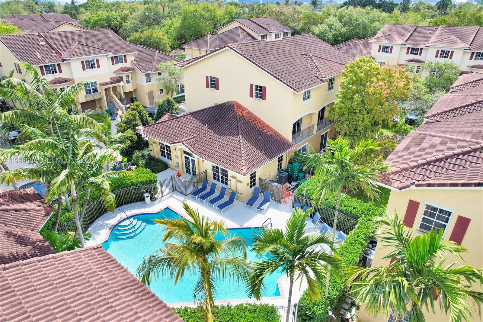 738 Northeast 90th Street, Unit 207 Miami, FL 33138 - Photo 29 of 31 an aerial view of multiple houses with a yard