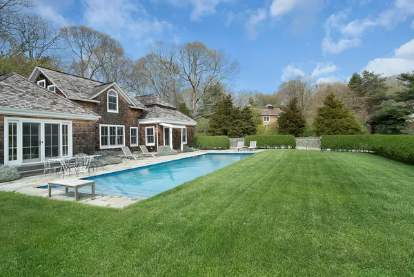 a front view of house with yard and seating area