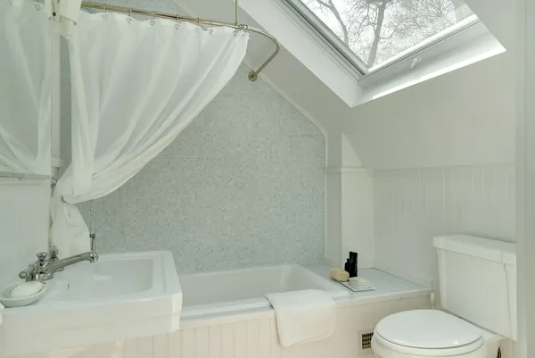 a bathroom with a sink toilet and bathtub