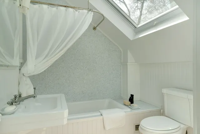 a bathroom with a sink toilet and bathtub