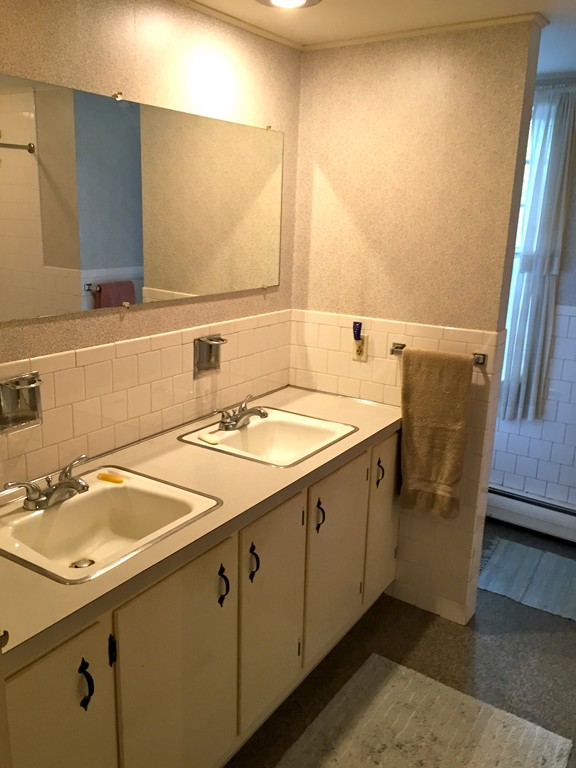 142 Brookfield Road Sturbridge, MA 01518 - Photo 6 of 7 a bathroom with a sink and a mirror