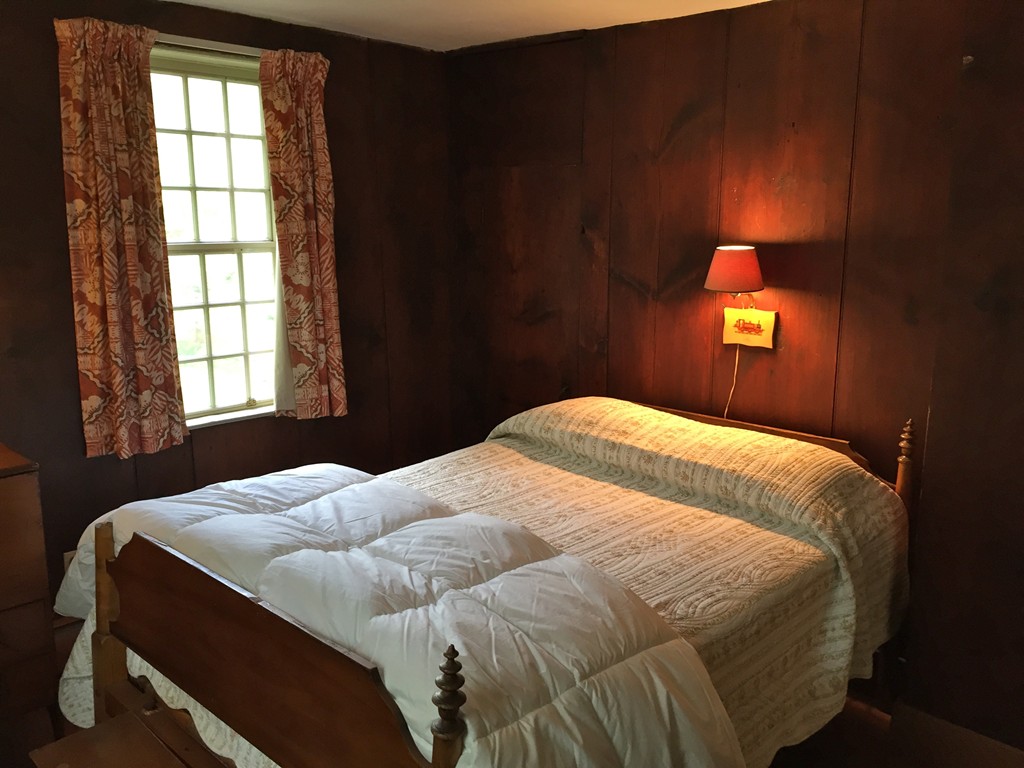 142 Brookfield Road Sturbridge, MA 01518 - Photo 7 of 7 a bedroom with a bed and window