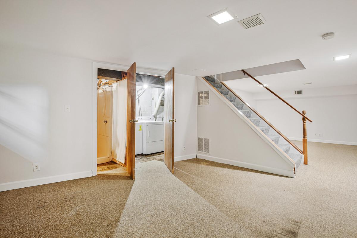 1016 Winsford Road Towson, MD 21204 - Photo 31 of 42 a view of a hallway with staircase